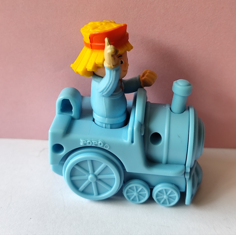 Vintage Jollibee toy Popo riding a train